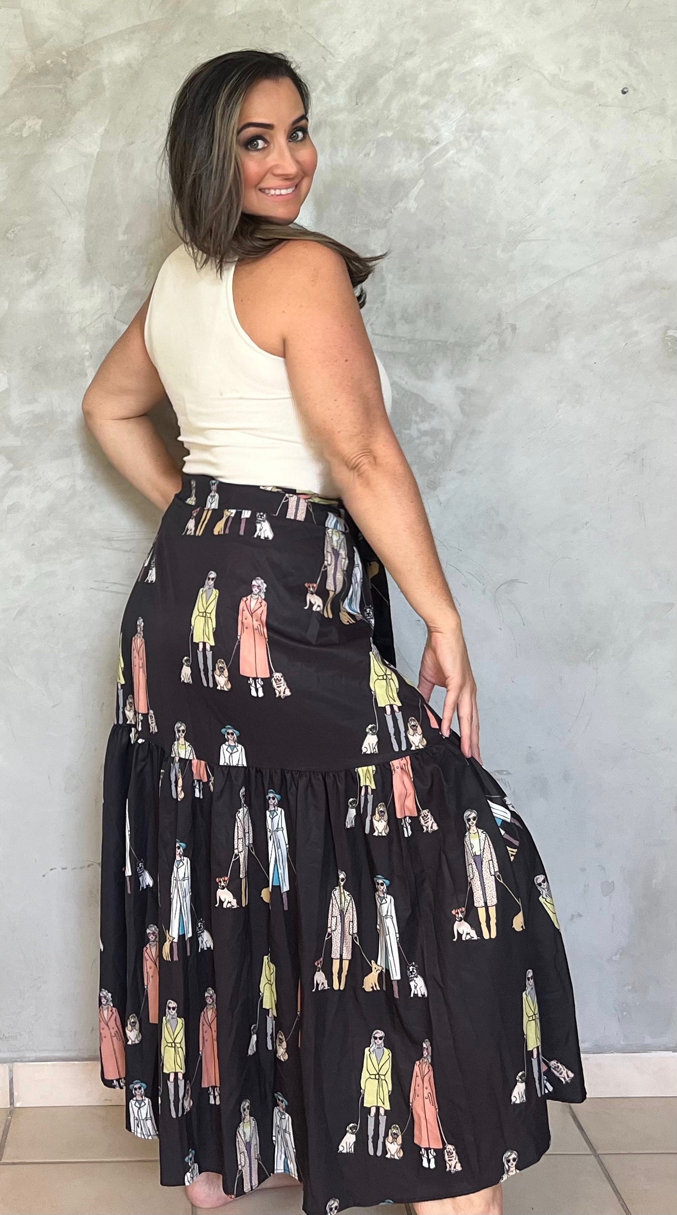 BLACK DOLL PRINT WRAPAROUND SKIRT